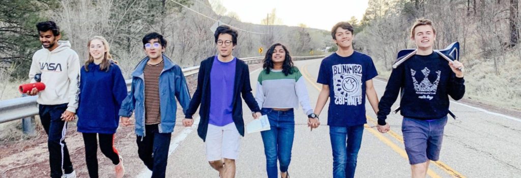 Group of Students Holding Hands While Walking