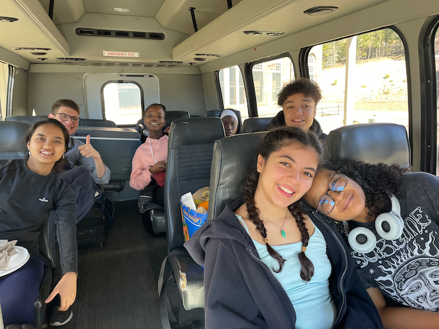 Diverse students on a UWC-USA bus on their way to a CAS community engagement activity.