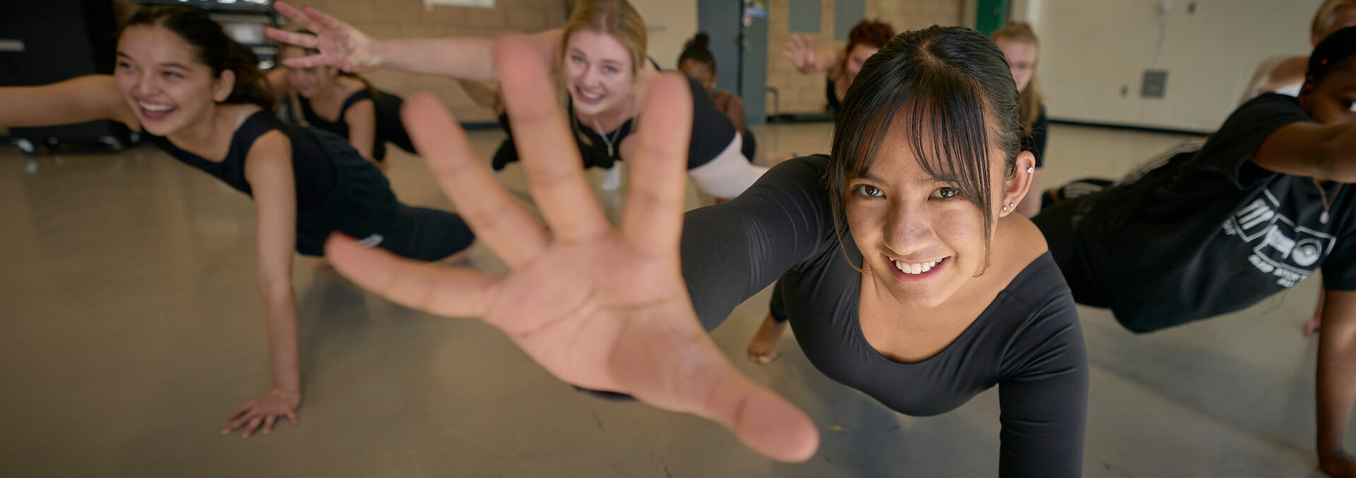 Diverse UWC-USA students joyfully practice dance, embodying global community and the school’s commitment to holistic education.
