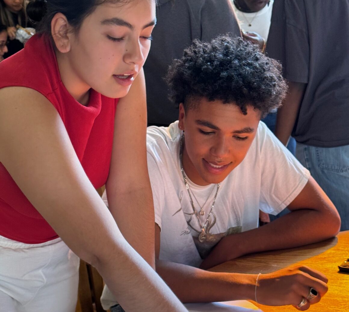 Students from diverse backgrounds collaborate on an academic project, reflecting UWC-USA’s inclusive global community.