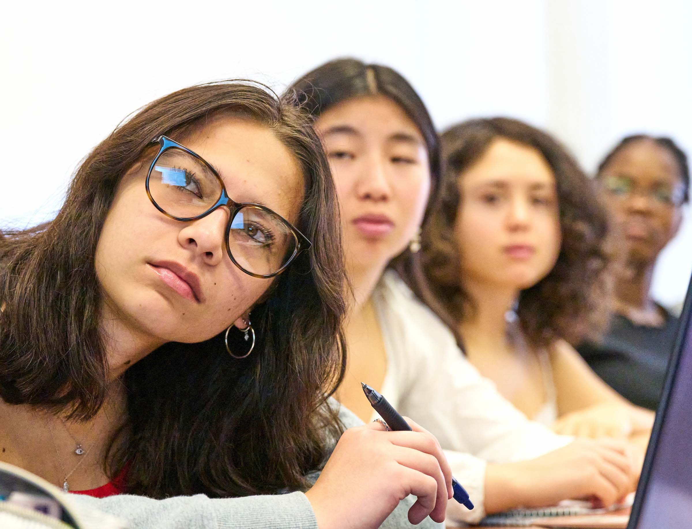 Diverse UWC-USA students engage thoughtfully in an IB classroom, reflecting global community and commitment to academic excellence.