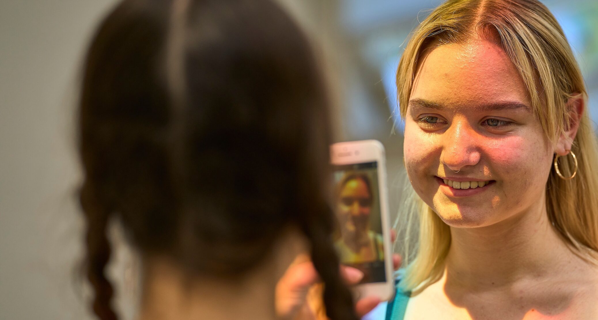 Student taking another student's photo in the Dwan Light Sanctuary at UWC-USA.