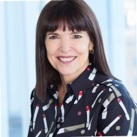 A smiling student in a patterned shirt stands against a blue-toned background, reflecting UWC-USA’s diverse, inclusive spirit.
