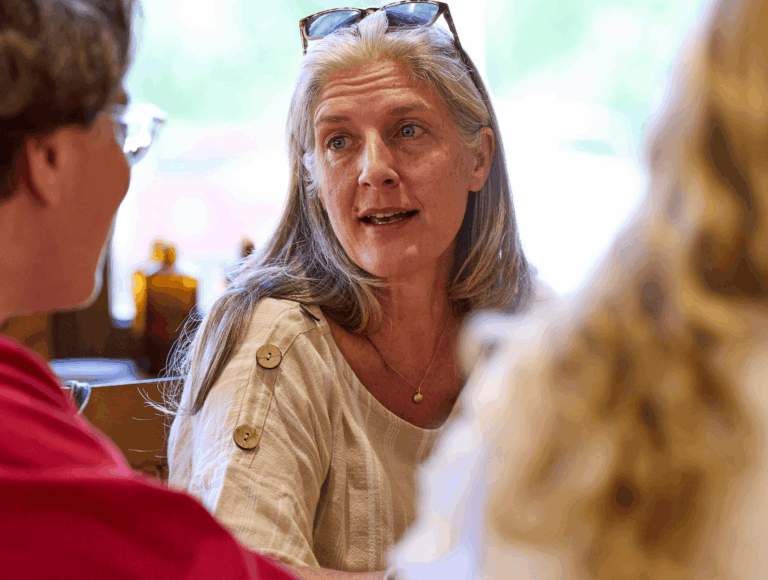 IB Teacher sin discussion with a student at UWC-USA.