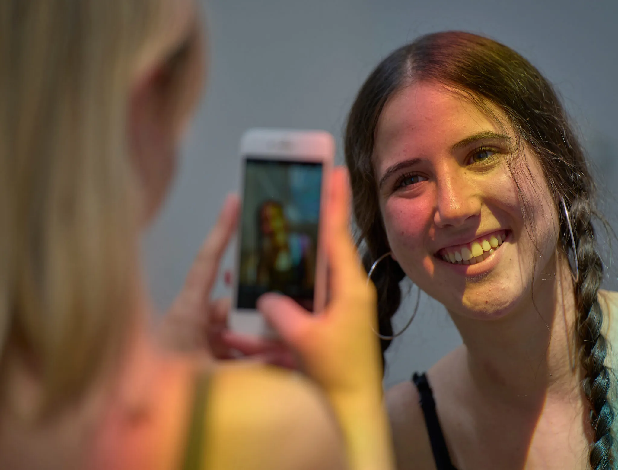 Student taking photo of another student in the Dwan Light Sanctuary.