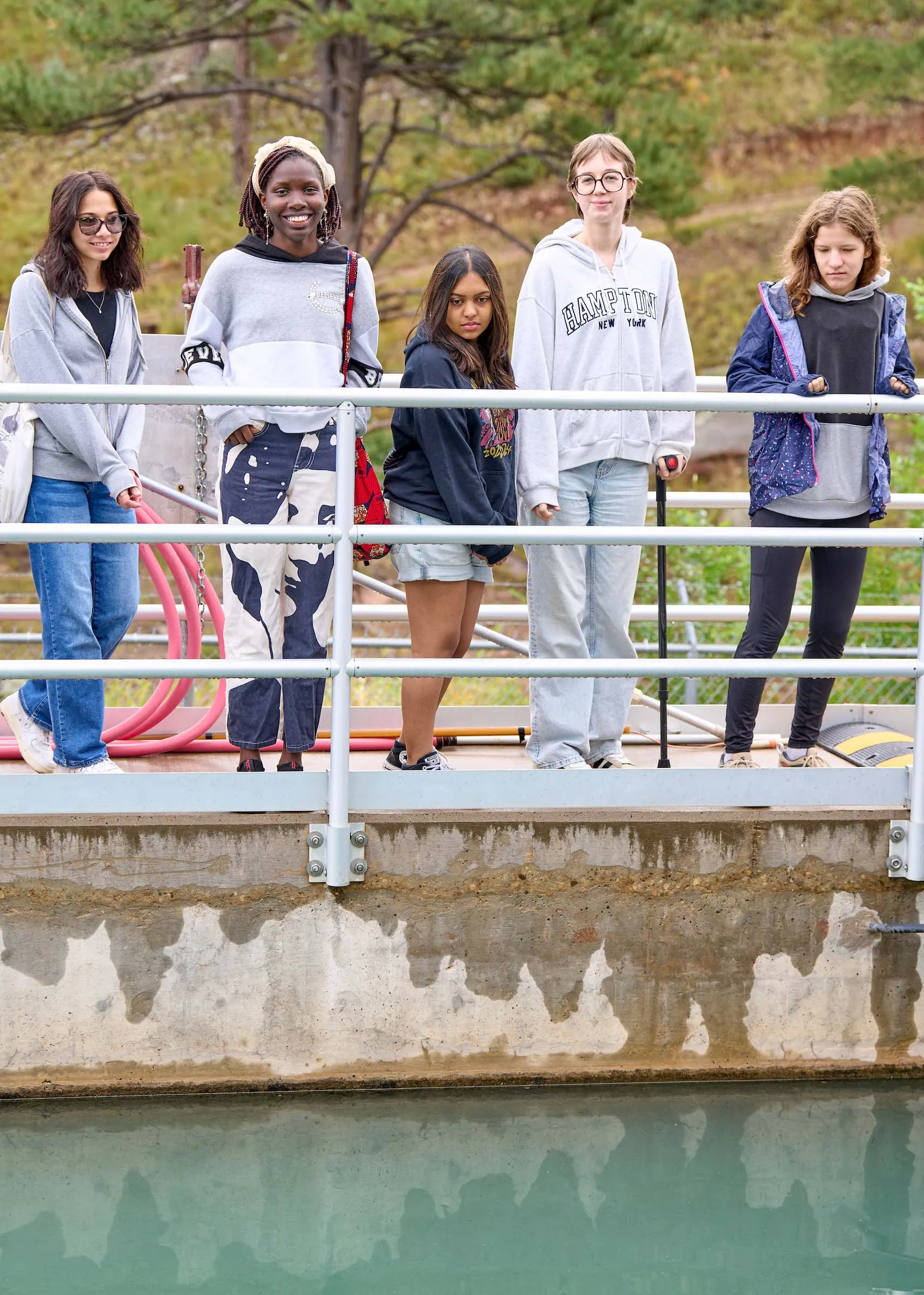 Students from diverse backgrounds with smiles on their faces on a learning expedition to the water treatment facility in Las Vegas, New Mexico.