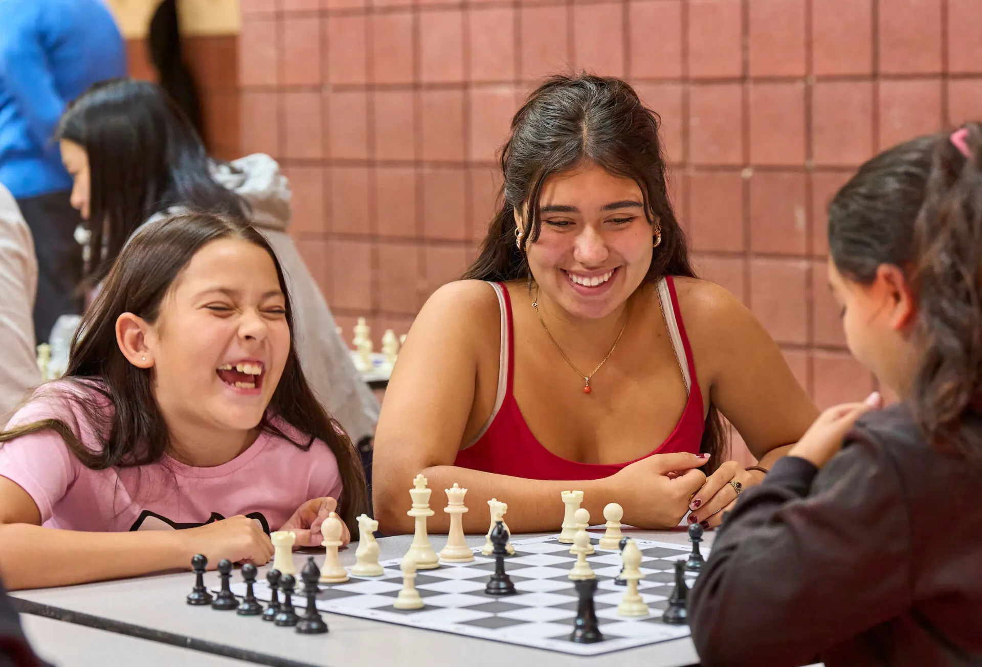 UWC-USA student engages with the community through a game of chess with local school children from Las Vegas, New Mexico.