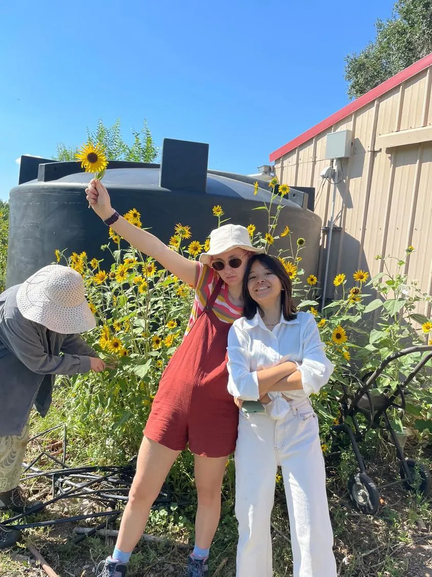 Students from diverse backgrounds engage in sustainable gardening, embodying community and service at UWC-USA.